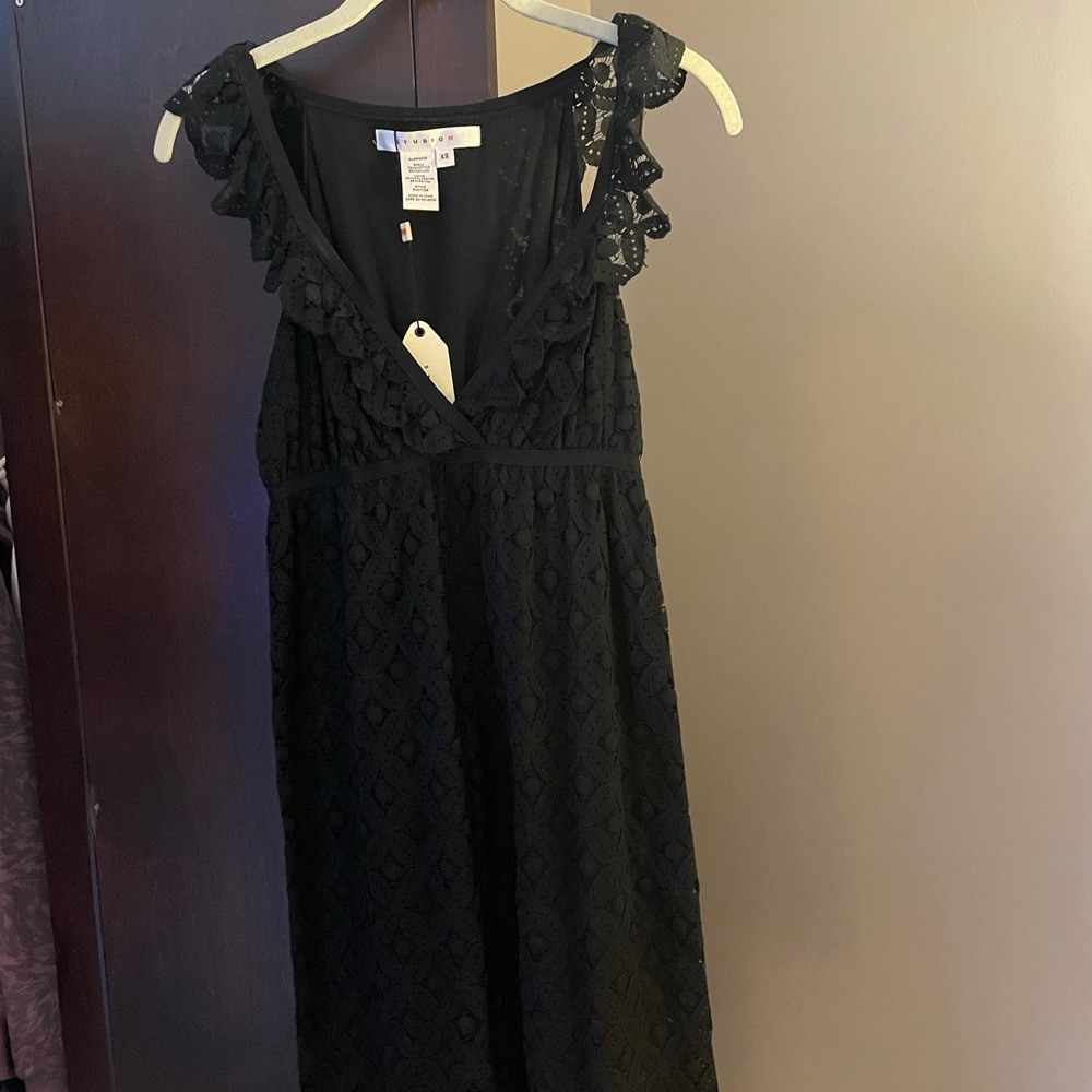 Beautiful black lace dress with deep v neckline. Never worn!